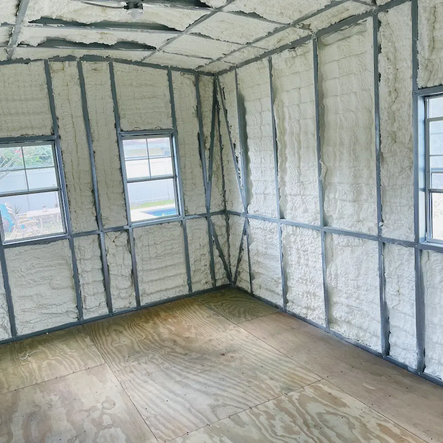 Closed-cell spray foam insulation applied to wall cavities in a residential project in Beltsville